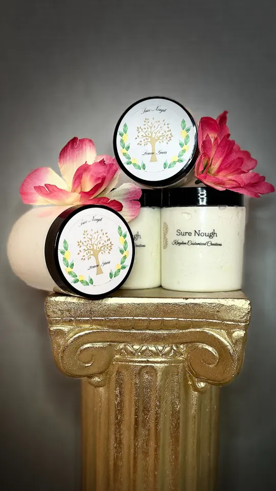 Sure Nough lemongrass body butter displayed with pink flowers